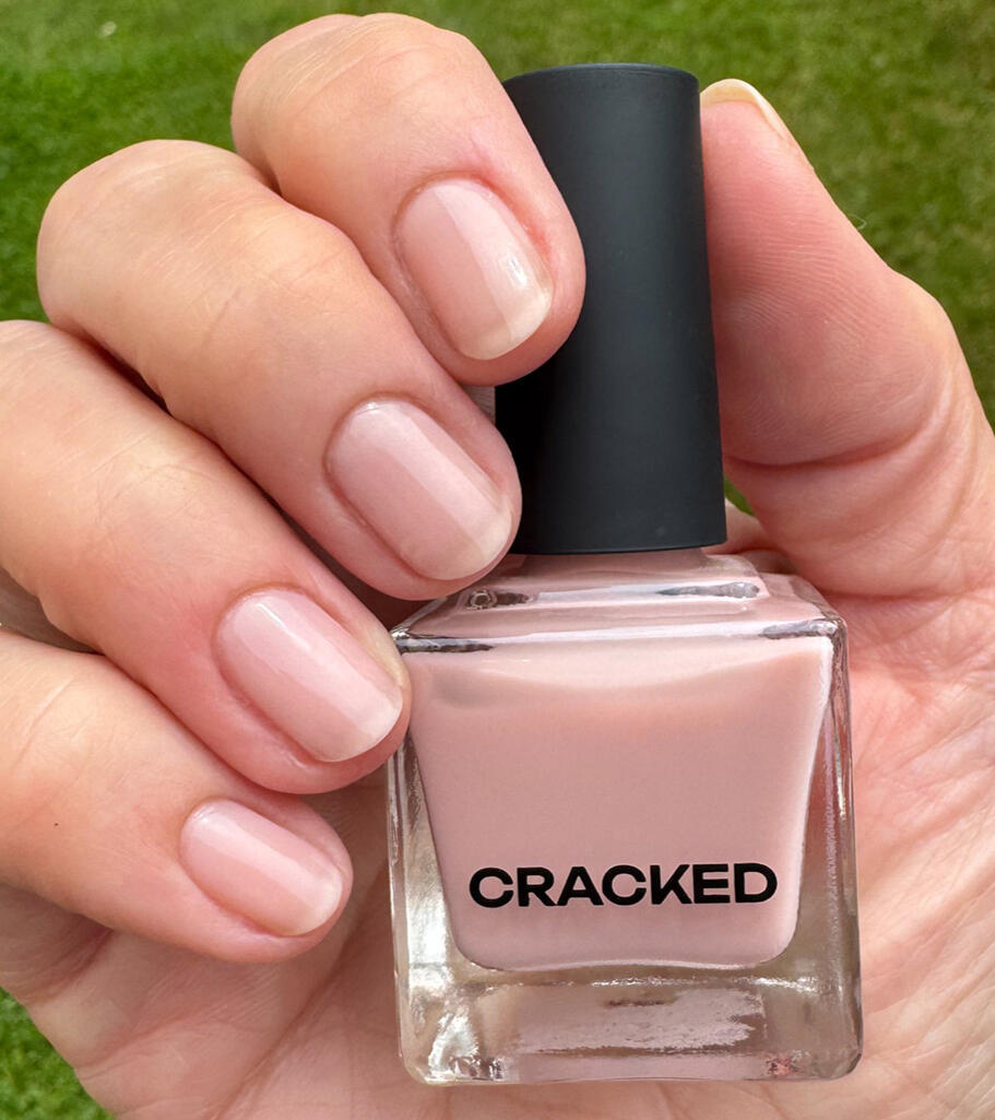 True-to-color swatch, Cracked Polish Spill the Tea, on short natural nails in natural lighting.