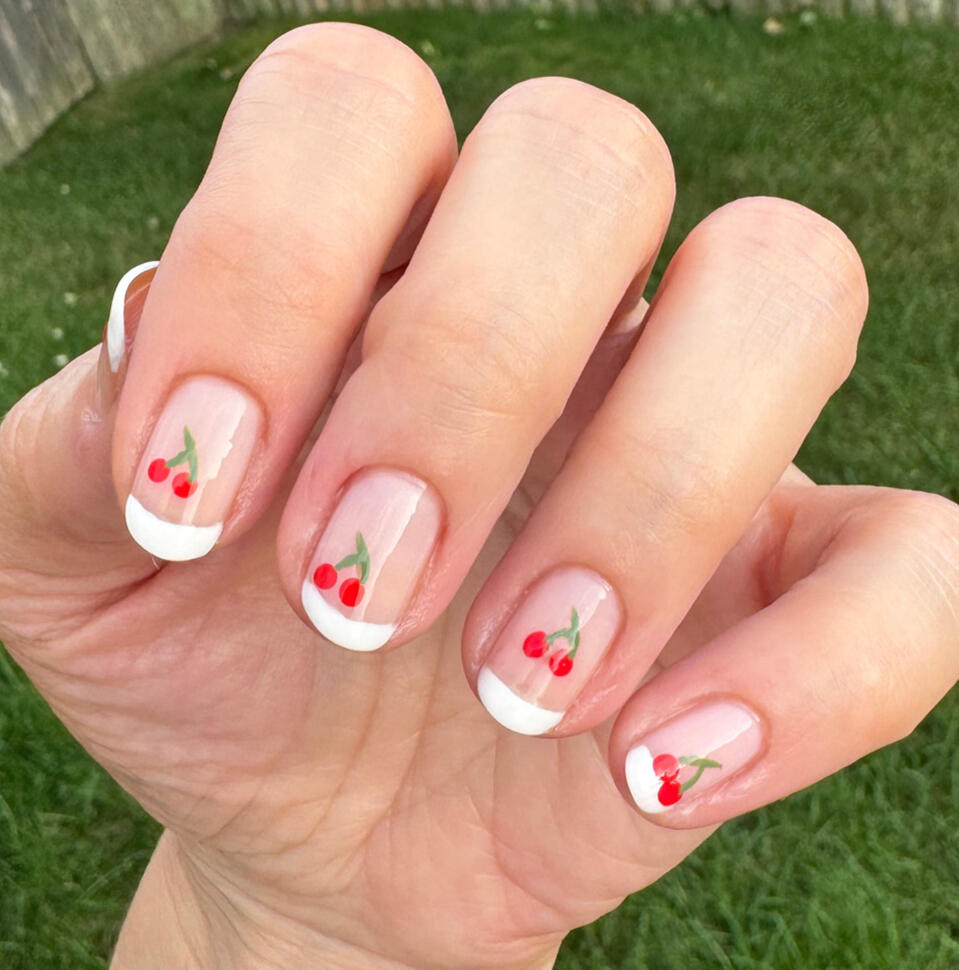 Minimalist grid nail art, neutral tones, on short natural nails in daylight.